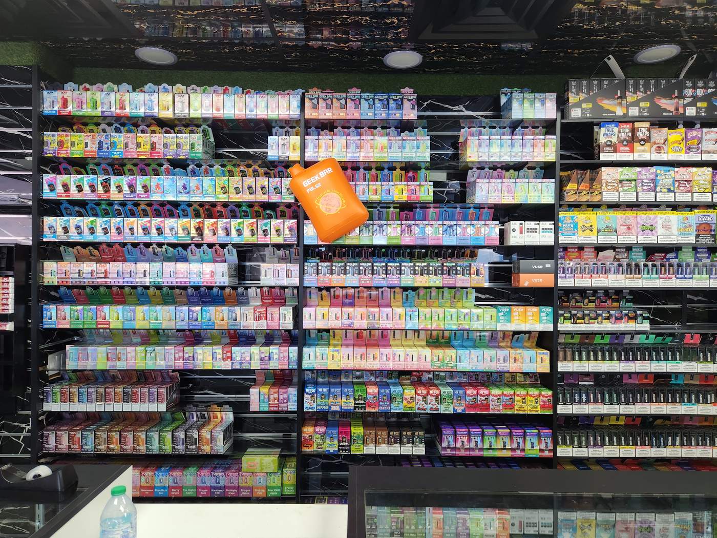 Vape and e-liquid wall at One and Done Stop Shop, smoke shop in Canton, OH